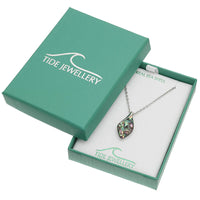A silver chain necklace with an iridescent abalone shell pendant displayed in an open teal Tide Jewellery gift box on a white background.
