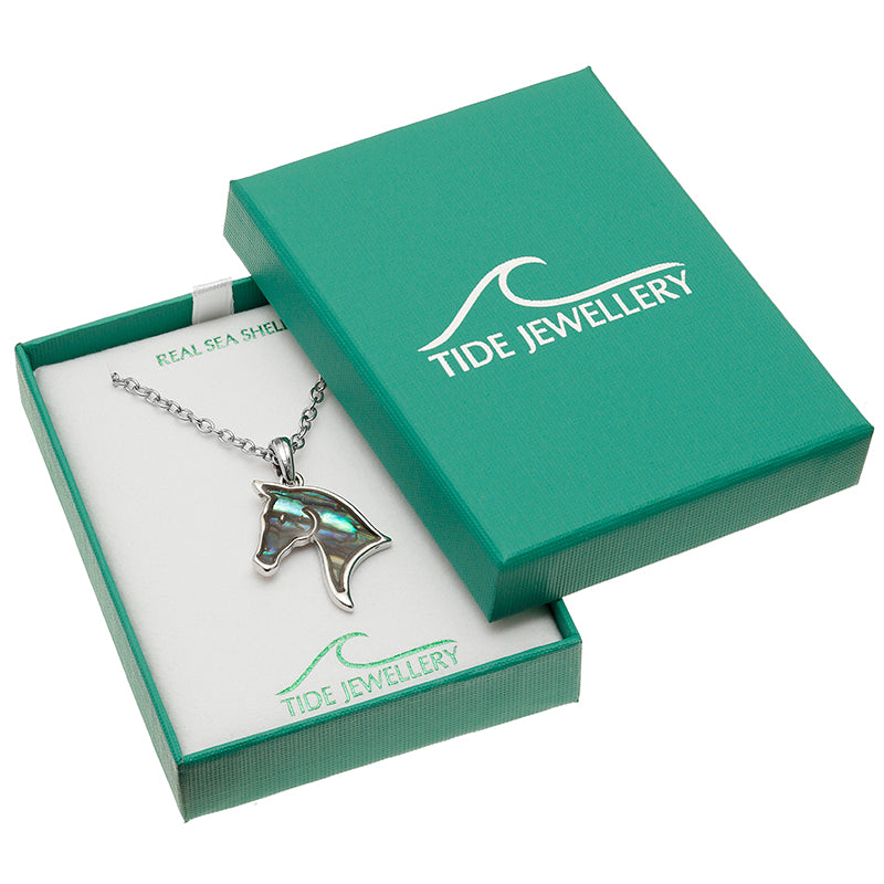 Jewelry box with a horse-shaped pendant and Tide Jewellery branding.